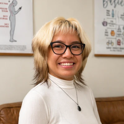 A headshot of Kim Garcia, a chiropractic assistant at Resolve Chiropractic.