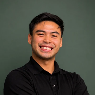A headshot of Dr. Fiel Buencamino, a chiropractor at Resolve Chiropractic.